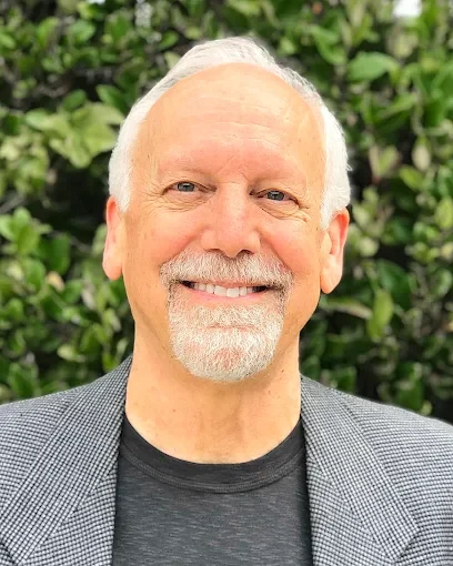 Dr. Kevin Downing smiling outdoors